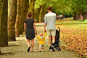 child walks with parent