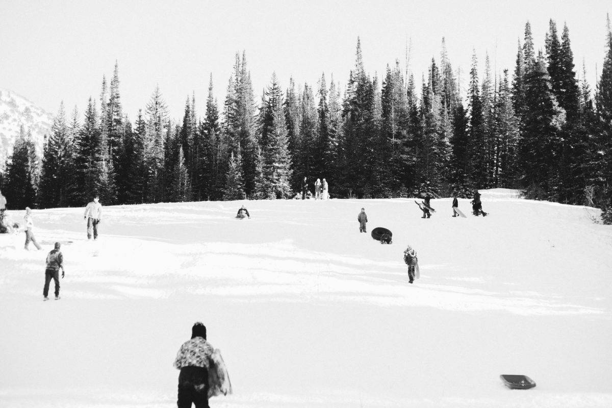 black and white image with people tubing