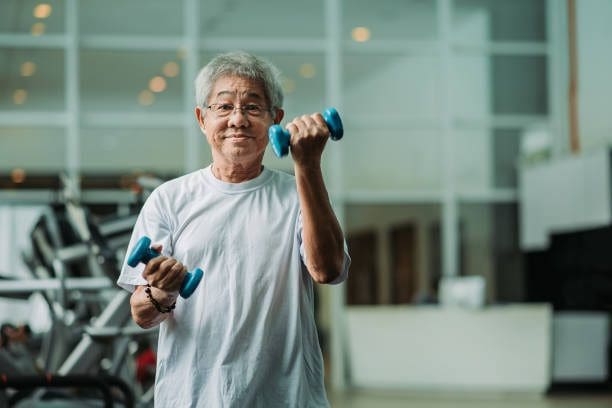 healthy lifestyle- senior woman with weights